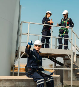 Technician and Engineer Working on a Windmill Turbine in the Field, Harnessing Renewable Energy for Sustainable Power Generation, Using Advanced Technology and Innovation to Support the Environmental